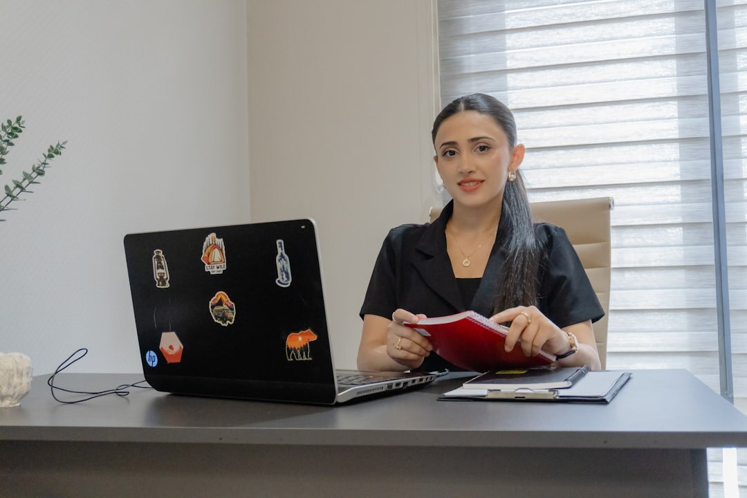Journalist reviewing photo contact sheets at a desk