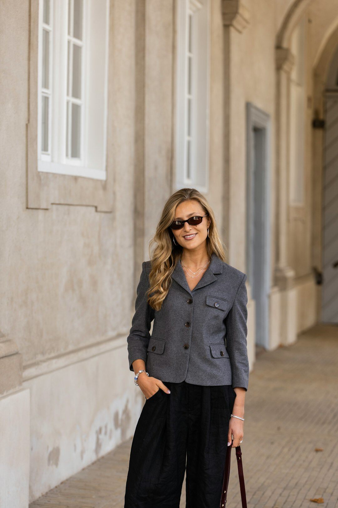 Danish female journalist smiling in casual outfit