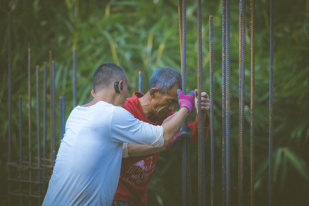 elderly man helping neighbor
